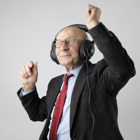 man in black jacket wearing black headphones